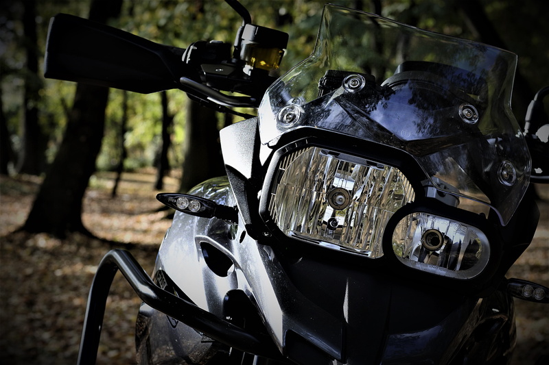 motorcycle, focus on foreground, nature, engine, safety, bmw, security, land vehicle, close-up, helmet, mode of transportation, 5K, transportation, outdoors