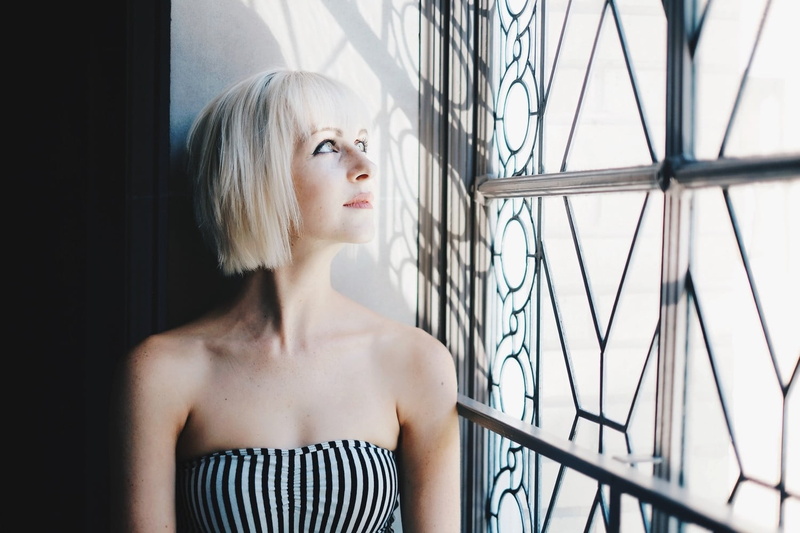 window, strapless dress, hairstyle, contemplation, blonde, young women, indoors, lifestyles, women, looking out window, adult, headshot, portrait, looking away