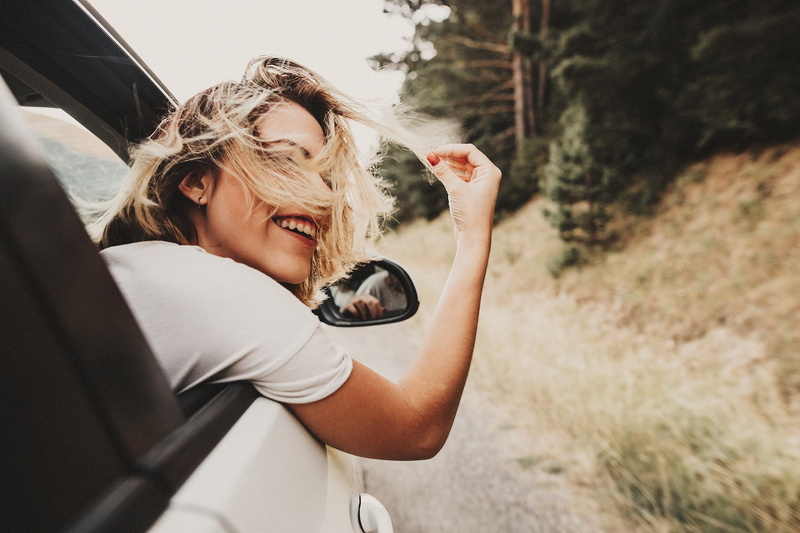 beautiful woman, young adult, portrait, women, young women, 1080P, hair, land vehicle, adult, hair in face, smiling, day, mode of transportation, leisure activity