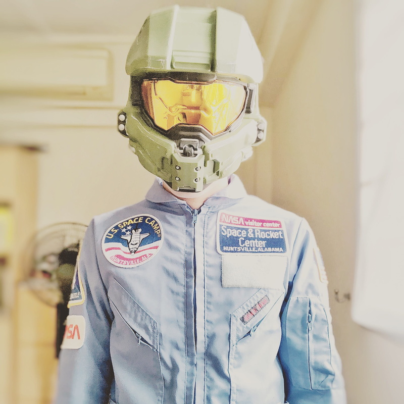 helmet, indoors, safety, uniform, front view, architecture, halo, wearing, protection, child, person, portrait, focus on foreground, 1080P, human body part