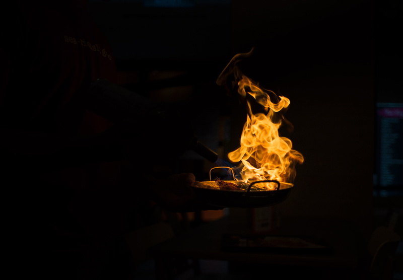 metal, no people, copy space, indoors, wood - material, fire, orange, preparation, orange color, flame, motion, flamed, pan, grill, close-up, heat - temperature