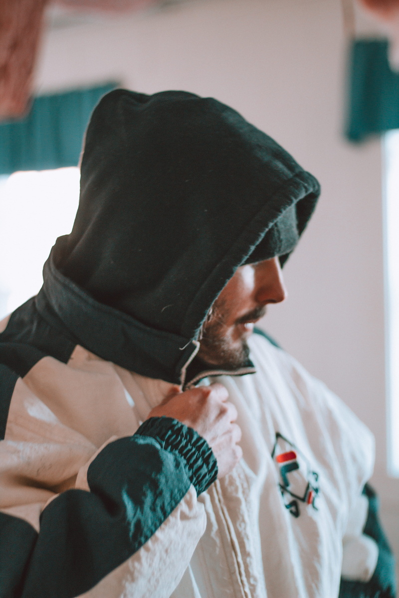 focus on foreground, casual clothing, indoors, house, cap, men, rapper, males, wealth, senior adult, model, holding, care, healthcare and medicine, wave
