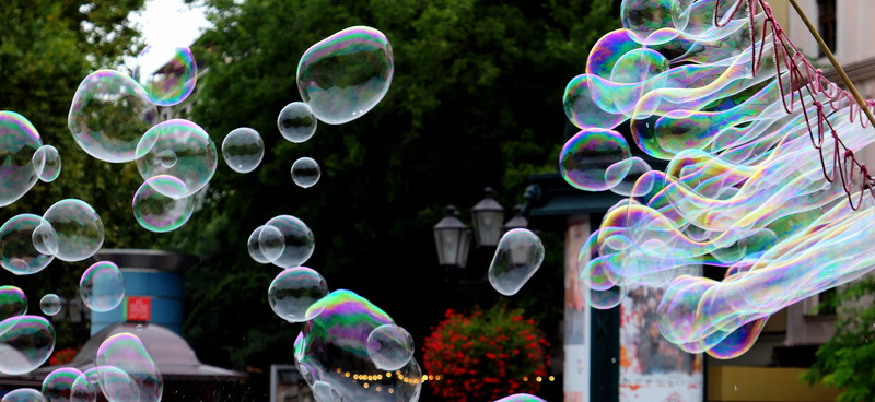 outdoors, foam, softness, tree, soap bubbles, ball, close-up, design, transparent, multi colored, mid-air, nature, fun, focus on foreground, childhood