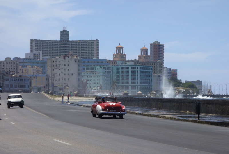 incidental people, joy of life, hispanic, city, latino hispanic, outdoors, fun, sunlight, traveling, cuba, car, kai, hotel, road, classic, street, office building exterior