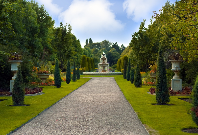 royal garden, white, religion, spirituality, tree, nature, surrounded, statue, male likeness, green color, representation, fountain, sky, cloud - sky, building