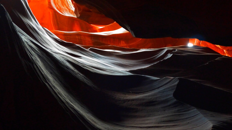 no people, motion, navajo, beauty in nature, cave, luminosity, pattern, indoors, black background, geology, non-urban scene, water, canyon, backgrounds