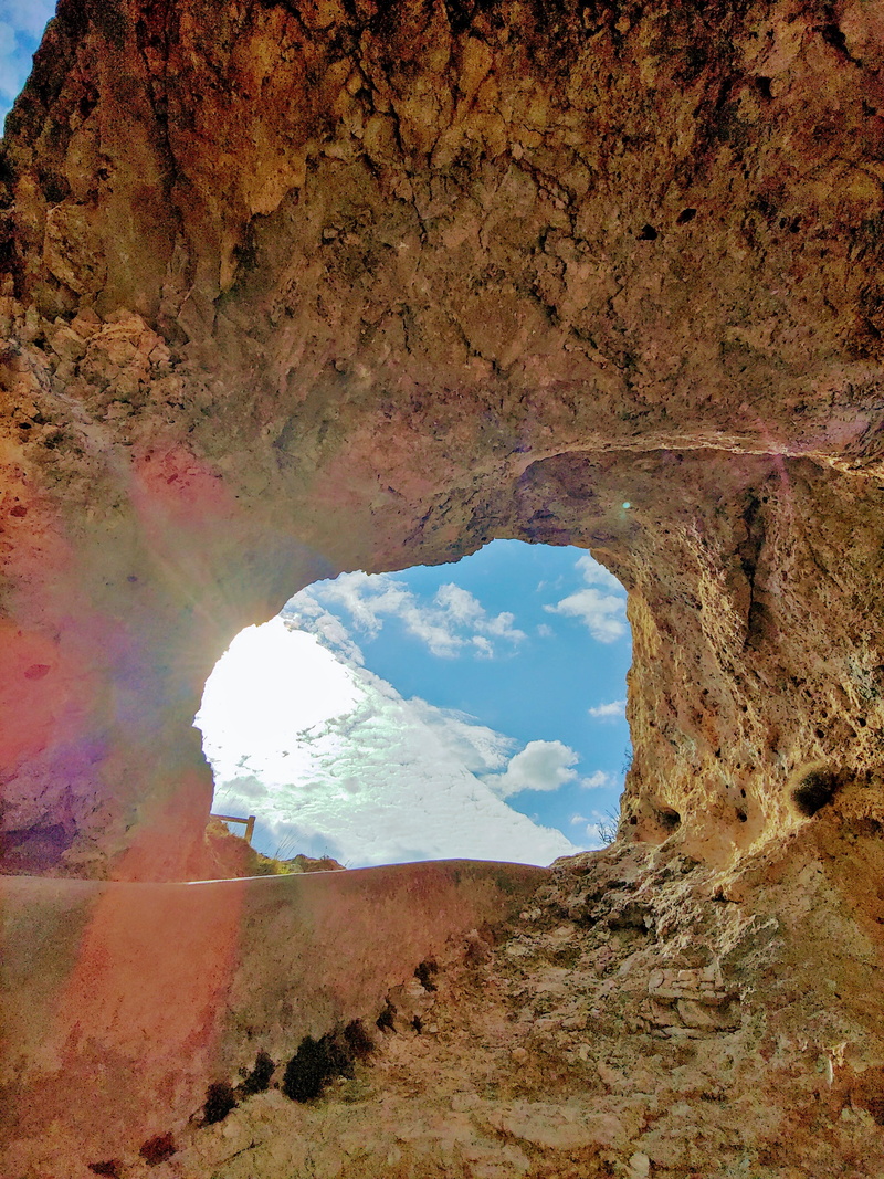 rock, window, cave, outdoors, geology, cloud - sky, physical geography, no people, arch, painting, rock formation, climate, scenics - nature, day, sky