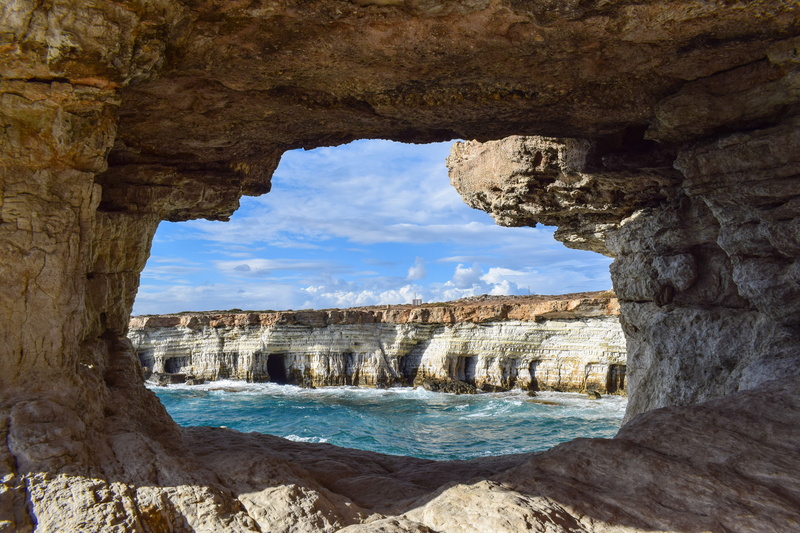 sky, daytime, built structure, land, window, rock formation, cyprus, tourism, sea caves, geology, scenery, rock, natural arch, scenic, cavo greko, water