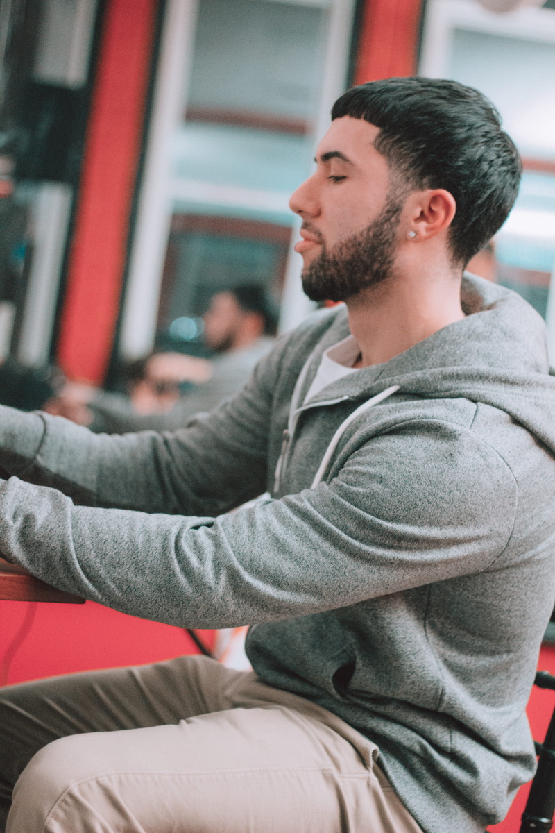music, looking away, apple, contemplation, facial hair, lifestyles, one person, young adult, internet, camera, barber, rap, looking, haircut, web, hair