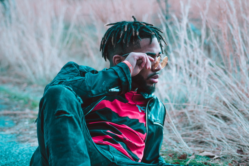 leisure activity, music, african, real people, portrait, braids, land, lifestyles, trap, holding, color, tree, haircut, glasses, plant, cold, modern, one person