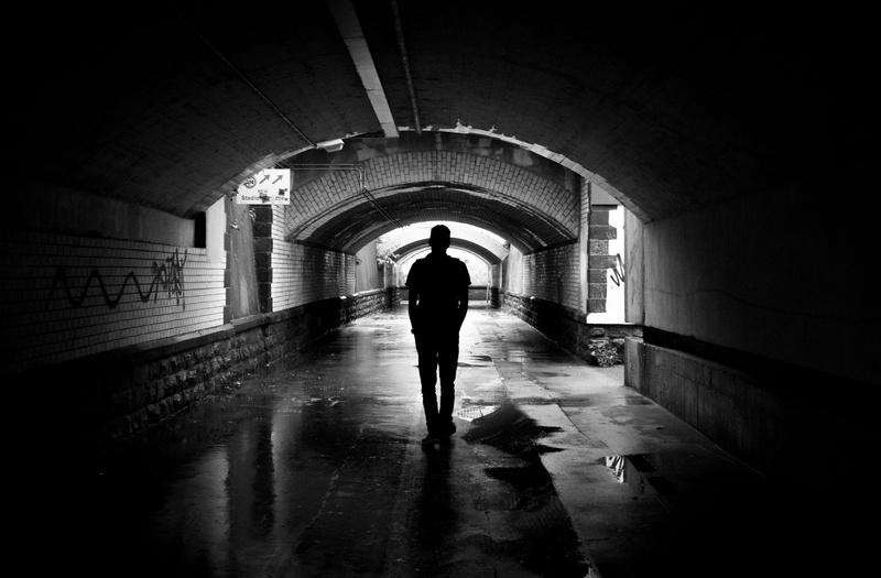 motion, leaving, street art, underground, stonewalls, passage way, alone, dark, black, path, black and white, direction, water, walking, men, vandalism