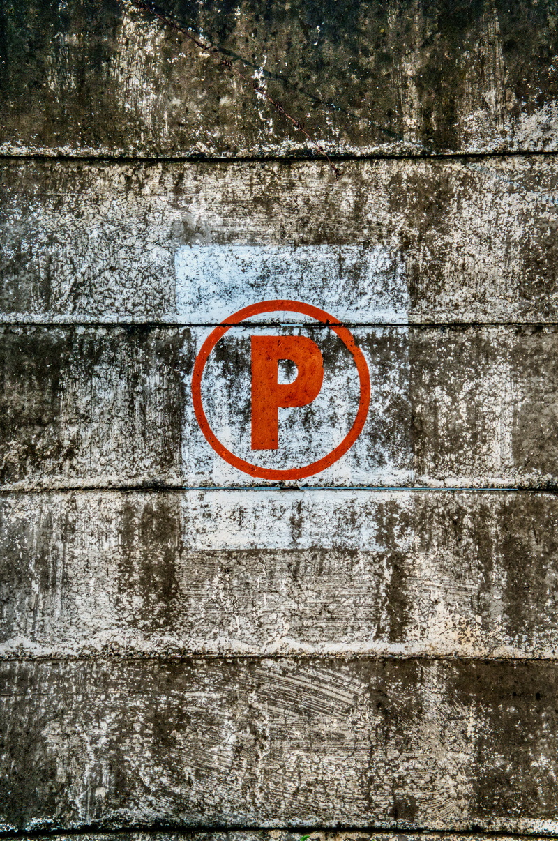 structure, no people, wood - material, sign, brick wall, exterior, outdoors, day, cement, colors, sumbol, logo, wall - building feature, solid, urban, stonewall
