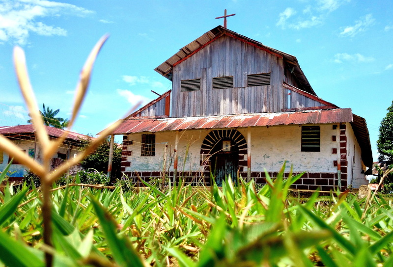 agricultural building, grass, mitu, day, monfort, wood - material, christianity, building, plant, house, no people, religion, land, nature, colombia, building exterior