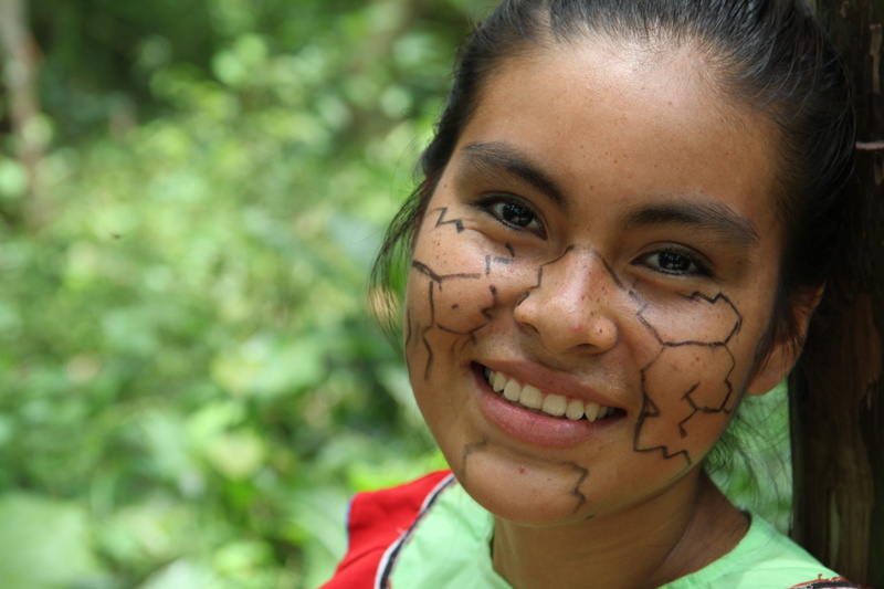 child, 5K, front view, innocence, women, focus on foreground, close-up, lifestyles, amazonia, toothy smile, emotion, looking at camera, portrait, smiling
