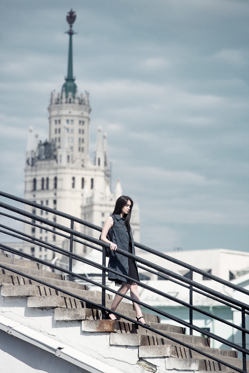 facial expressions, built structure, leningradskaya hotel, river, day, quay, girls, outdoors, stairs, high rise building, city, the moscow river, seven sisters
