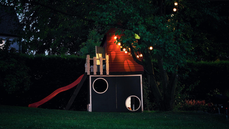 building exterior, green color, park - man made space, field, child, nature, growth, built structure, fun, illuminated, tree, land, crafts, play, outdoors