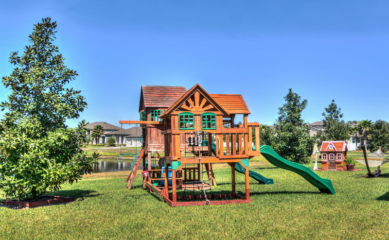 plant, house, outdoors, landscape, family, outdoor play equipment, green color, land, blue, no people, florida, playground, building, residential district