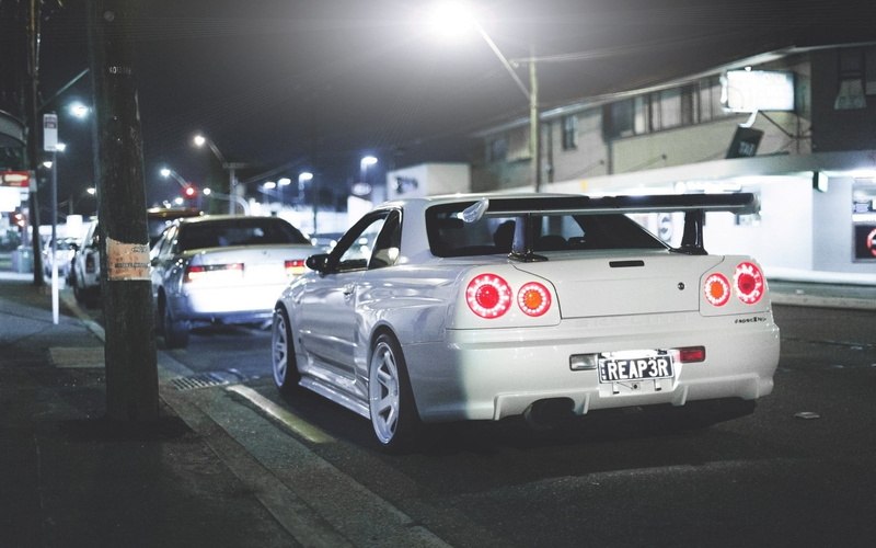 street, mode of transportation, red, architecture, night, 1080P, motor vehicle, parking garage, city, outdoors, nissan skyline gt r r34 v spec ii nissan skyline gt r r34 nissan jdm car