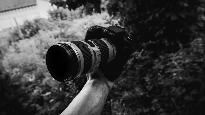 camera - photographic equipment, camera, real people, human hand, outdoors, holding, photographic equipment, digital camera, black, photography themes