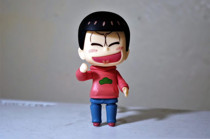 human representation, man, close-up, creativity, japanese, toy, play, cartoon, red, character, wall - building feature, smiling, plastic, robot, figurine