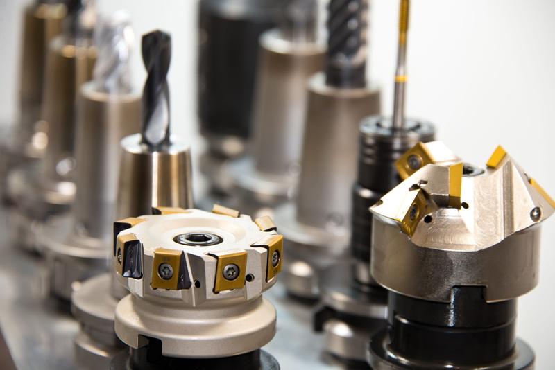 lens, focus on foreground, small group of objects, quality control, photo, indoors, science, milling machine, selective focus, machine, mechanics, drilling head