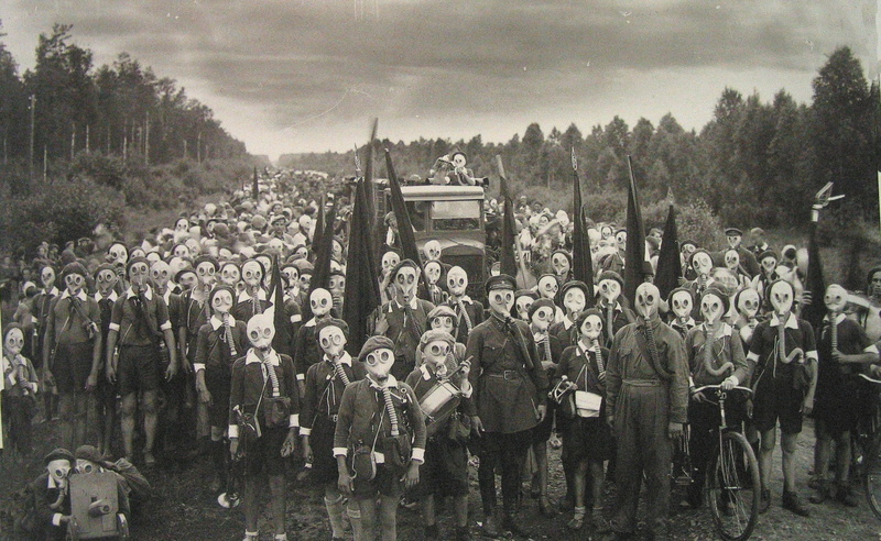transportation, photo, government, clothing, occupation, Vintage, sky, outdoors, plant, city, tree, gas, real people, day, grayscale, Mask, group, large group of people
