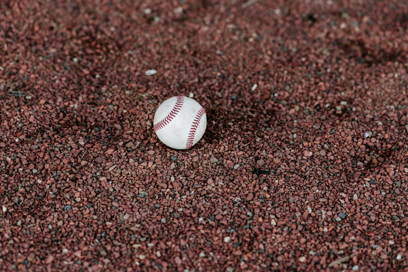 no people, glove, baseball bat, road, gravel, high angle view, sport, day, white, team sport, baseball glove, grassland, land, sports equipment, clothing