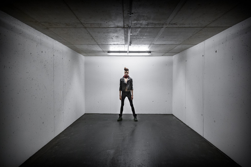 front view, 5K, young adult, man, ceiling, inside, parking garage, studio, standing, clothing, leisure activity, full length, adult, box, person, building