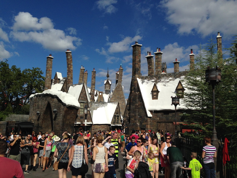 building exterior, outdoors, day, universal, florida, built structure, sidewalk, 2K, city, village, harry potter, lifestyles, women, set, tree, festival