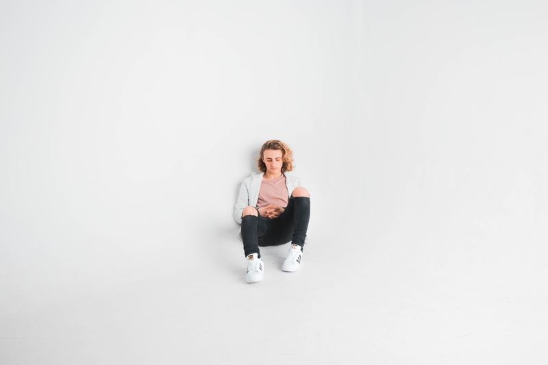male, e, one person, white background, adult, contemplation, copy space, full length, space, studio shot, c, fashion, white, s, alone, blond hair, sitting