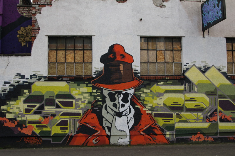 building exterior, architecture, alan moore, pop culture, arts culture and entertainment, outdoors, mural, building, creativity, window, wall - building feature