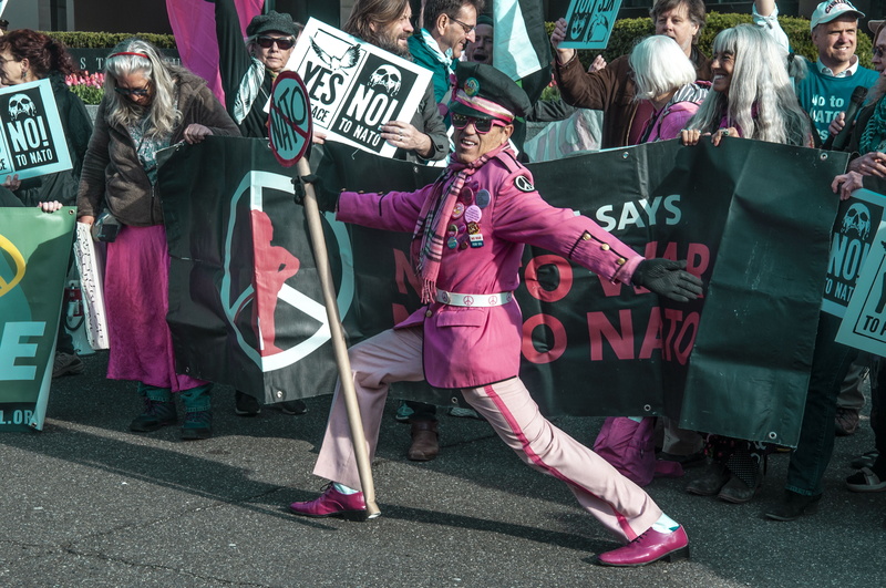 human, holding, street, military, card, marching, group of people, performance, communication, city, people, shoe, pink color, footwear, full length, united states