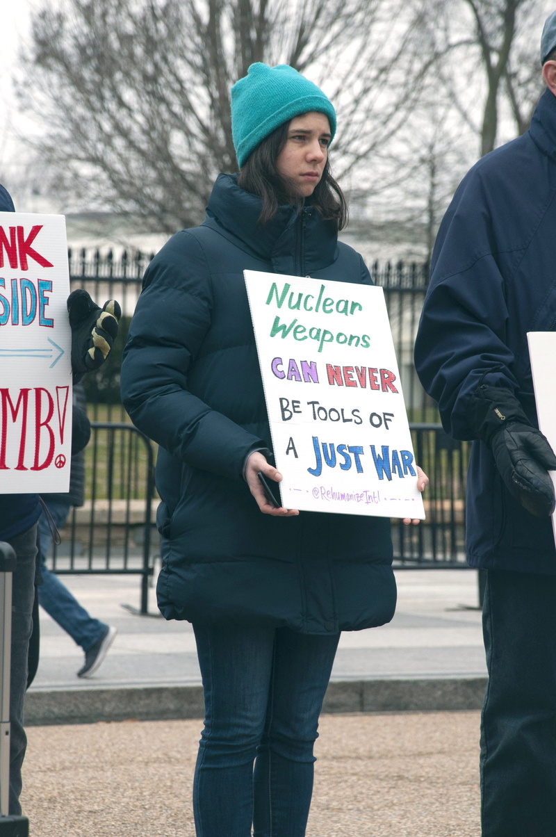 three quarter length, people, poster, human, casual clothing, coat, hat, clothing, placard, washington, real people, apparel, signage, person, protest