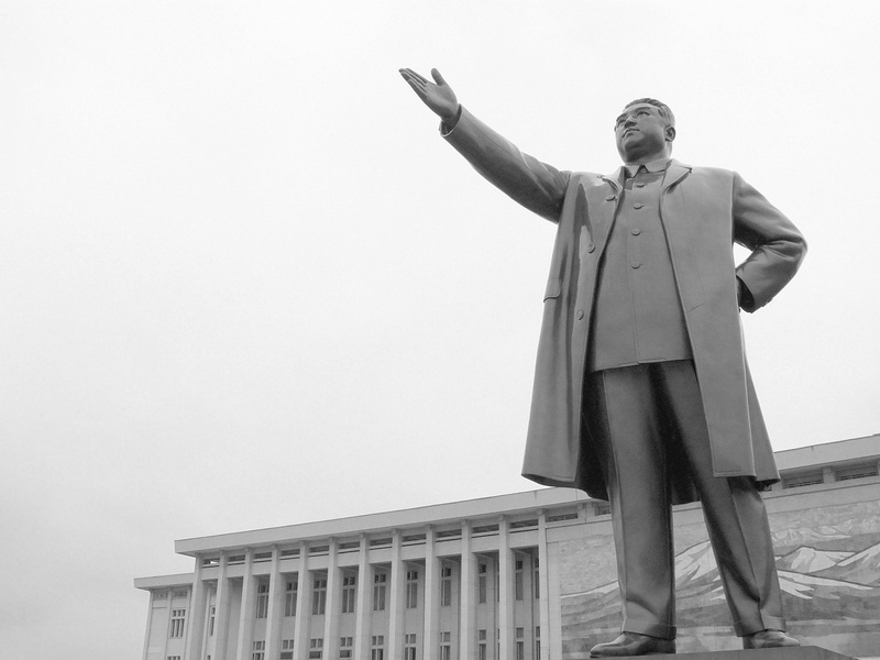 human arm, low angle view, clothing, one person, body part, day, arms outstretched, the past, 2K, copy space, built structure, architecture, kim il sung architecture dprk north korea rare statue