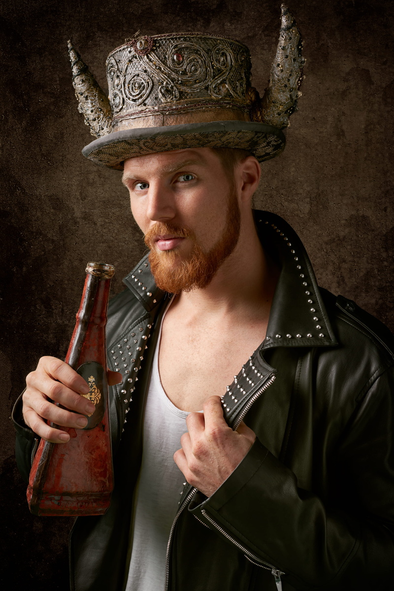 holding, young adult, adult, facial expression, male model, portrait, period costume, biker, jacket, government, front view, hat, art, fashion, posing
