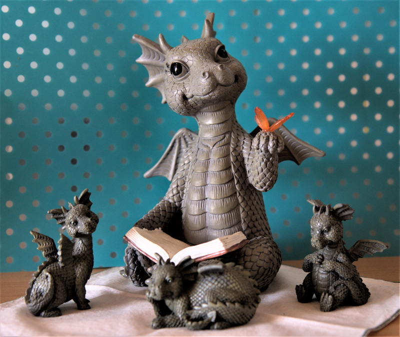 animal representation, blanket, indoors, dragon family read, figurine, domestic, butterfly, bizarre, studio shot, community, 4K, decoration, domestic animals
