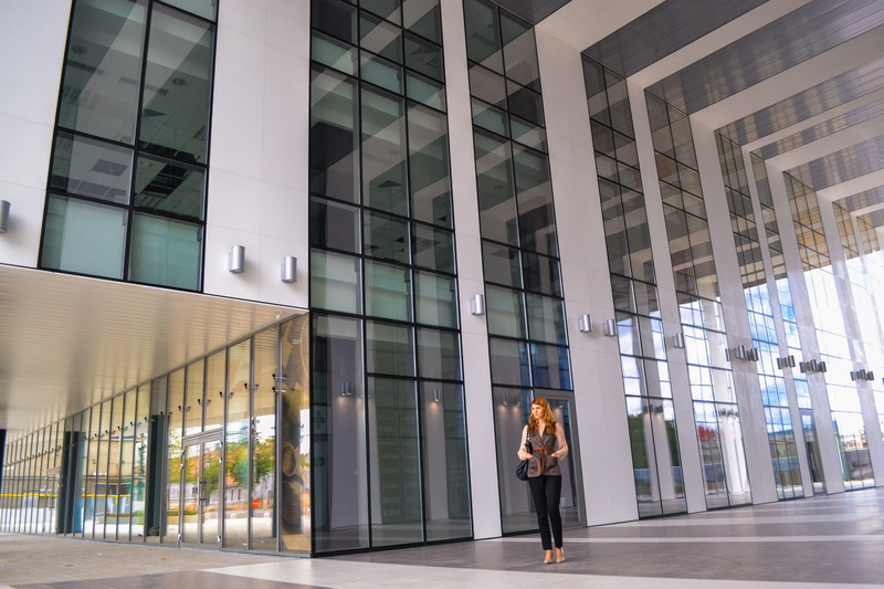 professional, real people, one person, front, street, modern, glass - material, beautiful, woman, day, young adult, building, business, standing, boss