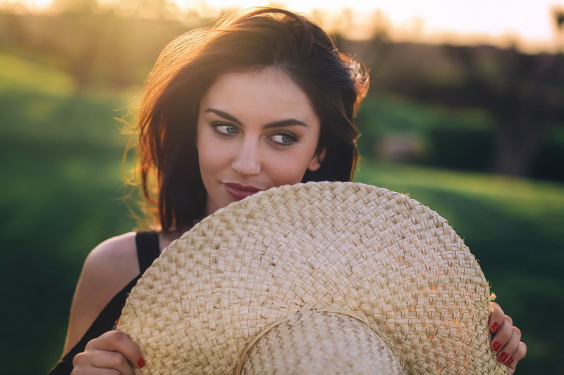 blue eyes, nature, depth of field, brunette, face, beautiful woman, outdoors, portrait, plant, hat, beauty, one person, hairstyle, young women, millinery