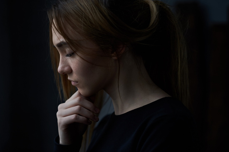 headshot, profile view, depression - sadness, adult, young women, indoors, close-up, studio shot, women, looking, sadness, lifestyles, looking away, one person