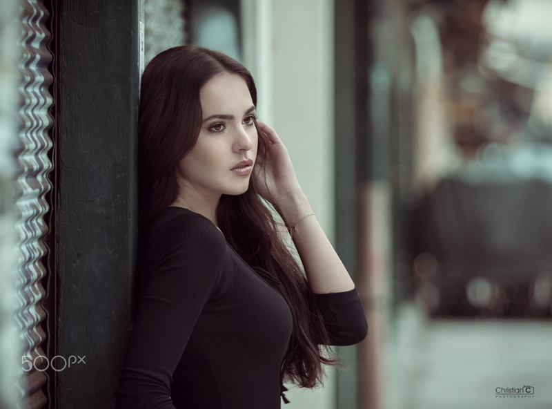 one person, brown hair, juicy lips, fashion, leisure activity, waiting, model, long hair, architectural column, looking, focus on foreground, 1080P, young adult