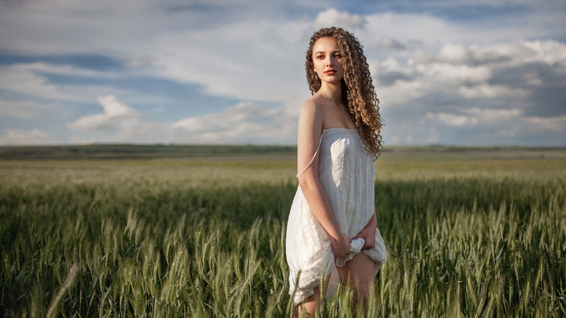 portrait, white dress, lifting dress, sky, dress, 2K, field, brown eyes, looking away, depth of field, blonde, model, bare shoulders, women, wheat, red lipstick