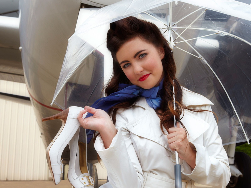 looking at camera, beautiful people, portrait, lifestyles, holding, women with planes, beauty, adult, hairstyle, young adult, beautiful woman, indoors
