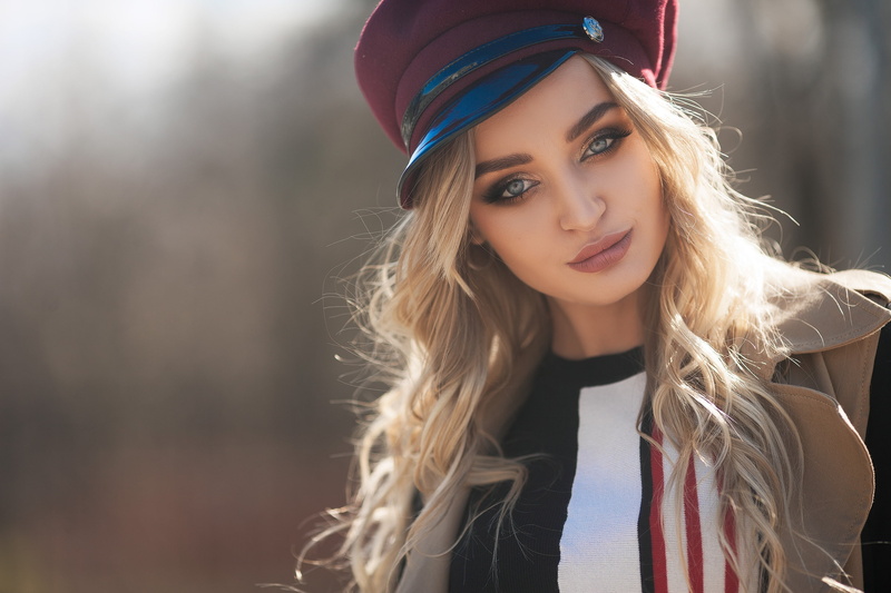 teenager, trench coat, real people, coats, leisure activity, blonde, hairstyle, beauty, front view, hair, women, women outdoors, fashion, beautiful woman