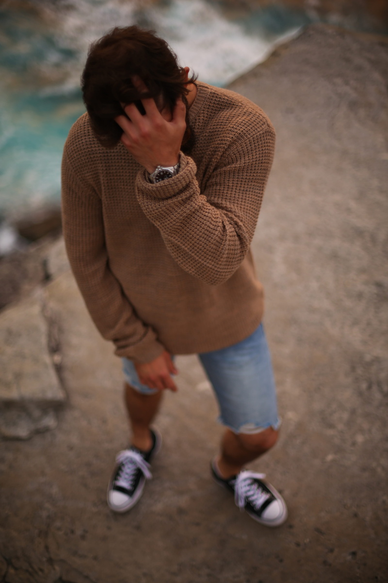 young adult, innocence, child, leisure activity, ocean, sweater, day, high angle view, men, casual clothing, males, one person, jeans, shore, watch, boys