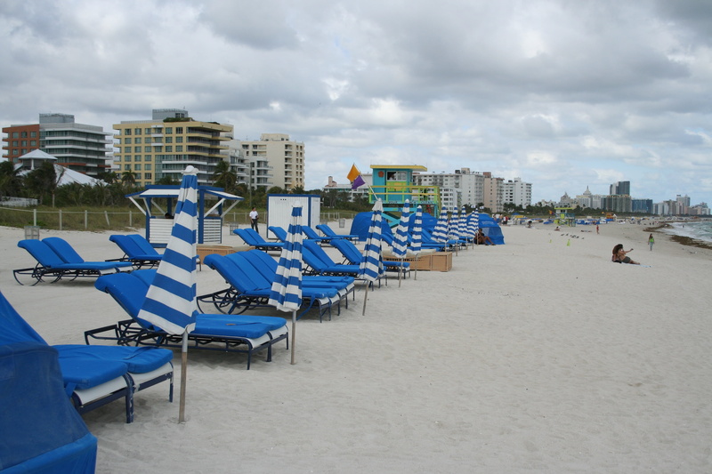 seat, city, bay watch, day, beach, building exterior, deck chair, sky, built structure, building, nature, chairs, waterfront, lounge chair, land, florida