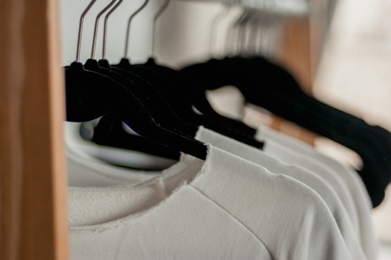 clothes rack, textile, clothes line, casual wear, luxury, absence, white color, personal accessory, close-up, still life, blur, white, business, focus on foreground
