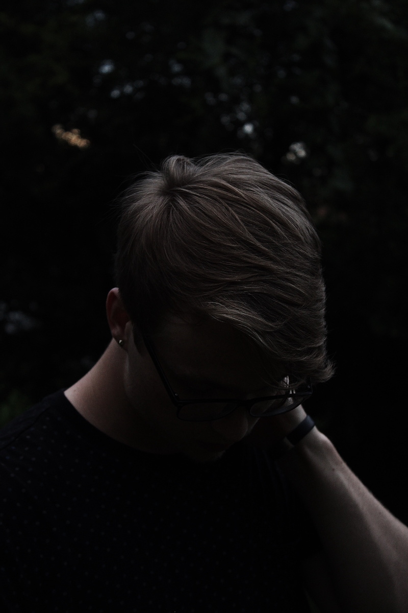 depression - sadness, sadness, close-up, adult, one person, rear view, leaning, only women, distraught, black background, black, downwards, adults only