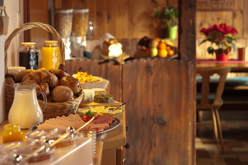 top, bottle, focus on foreground, meal, chee, restaurant, shift, focus, beside, plate, cafe, brown, indoors, wood - material, prepared, buffet, table, basket