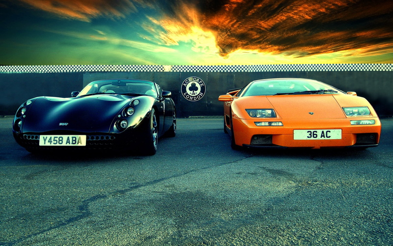 number, mode of transportation, vehicle, land vehicle, luxury, car, TVR, transportation, orange cars, sports car, no people, nature, black cars, taxi, sunlight
