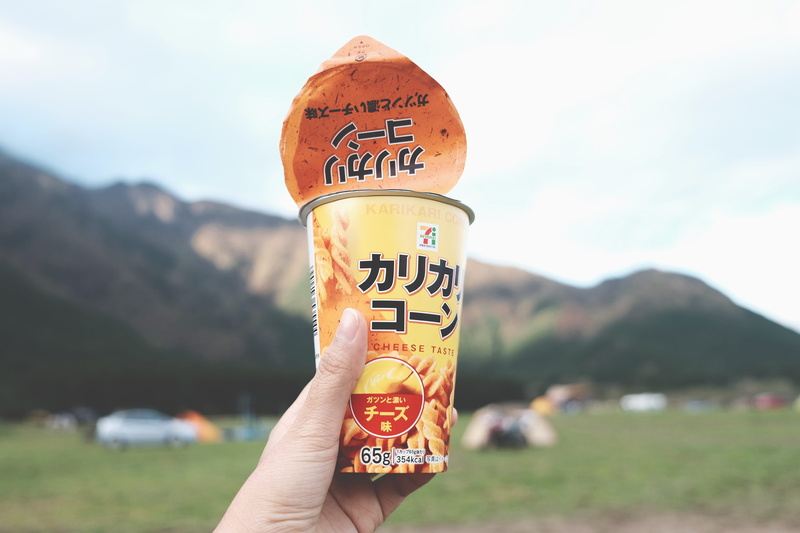 japan snack, potluck, cheese, day, japan, finger, cheese taste, snack, one person, mockup, for camp, human hand, 4K, focus on foreground, refreshments